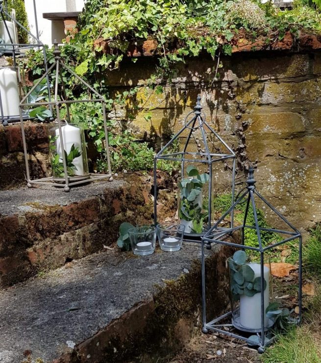 Glass and gold or pewter lantern with metal insert